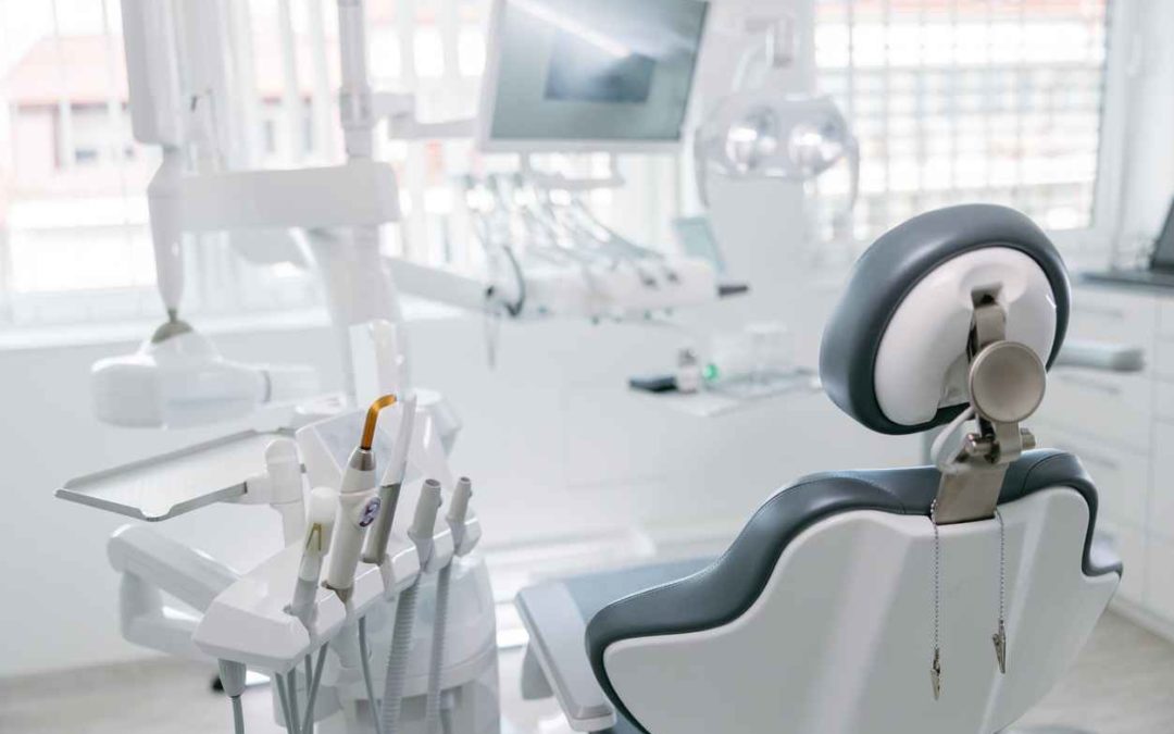 Modern dental drills and empty chair in empty dentist's office